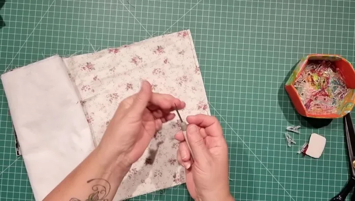 Create false bottom seam: Create a false seam at the bottom of the bag by slightly opening the bottom seam allowance( about half an inch) before turning the bag right side out.