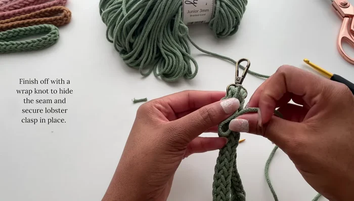 Complete the wrap knot by wrapping the working cord around the loop, ensuring even wrapping, and tucking the ends in.