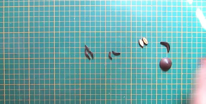 Create the reindeer's antlers: Make thin, bended semicircles with dark brown strips.