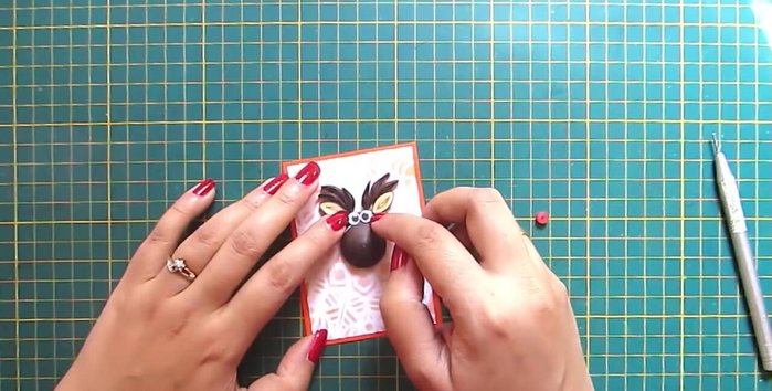 Add finishing touches: Write 'Merry Christmas' and attach a ribbon.