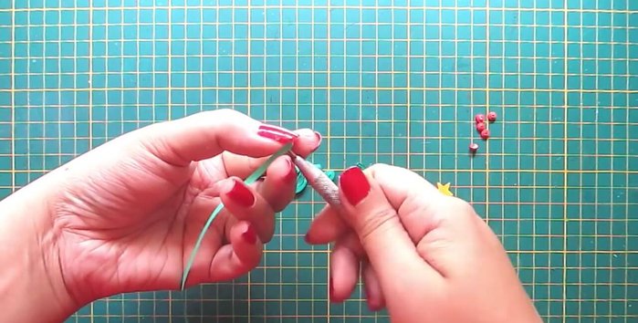 Create the tree trunk: Make a triangle shape with a dark brown strip.