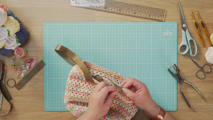 Add split rings (optional) for keys or purse attachment before attaching the second strap.