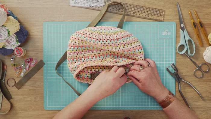 Secure the second strap in the same way as the first, ensuring the straps are symmetrical. Using sewing clips or paper clips helps ensure perfect positioning.