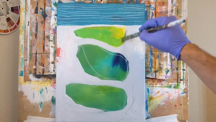 Blend and layer colors within the shapes, using a filbert brush for smooth transitions and maintaining some areas of bright, contrasting color.