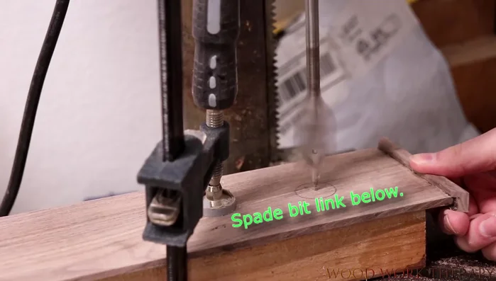 Drill a 1-inch hole (finger hole) on the top of the box using a spade bit.