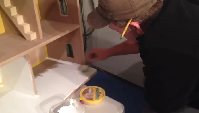 Painting: Three coats of semi-gloss white paint with primer were applied, taking three nights.