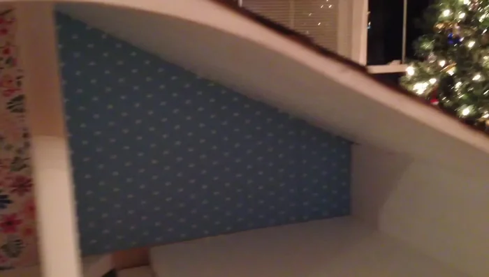 Wallpapering: Scrapbooking paper was used as wallpaper, applied using heavy-duty double-sided tape.