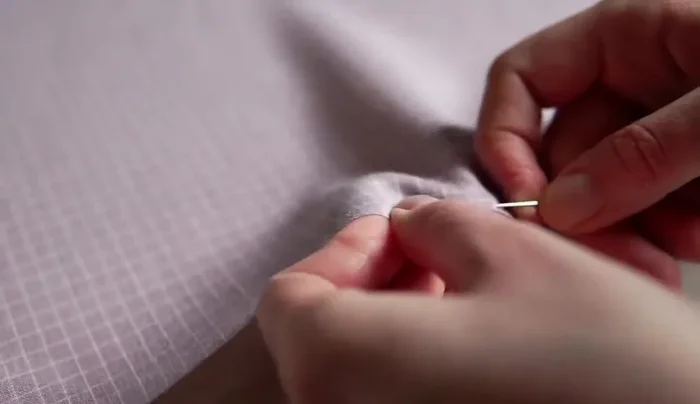 Use an invisible seam to finish the edges.