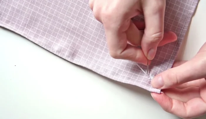 Use a scraper boss running stitch, followed by running stitches and cross stitches.