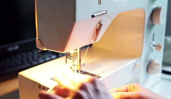 Iron edges in and topstitch two handkerchiefs by machine.