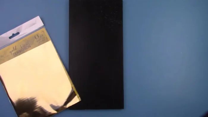 Rub a gold foil sheet over the gel; the gold will stick where the gel is.