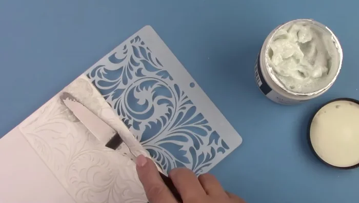 Spread glass bead gel over the stencil using a palette knife.