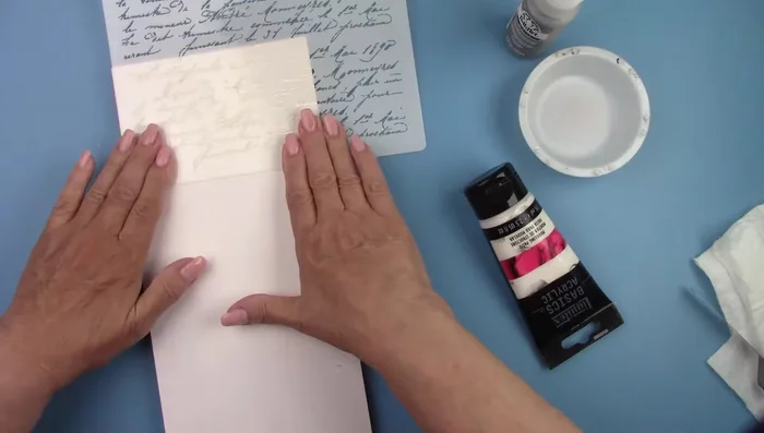 Spray the back of your stencil with repositionable spray adhesive.