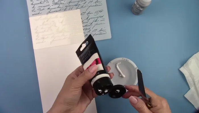 Mix modeling paste with gray paint (or any desired color).