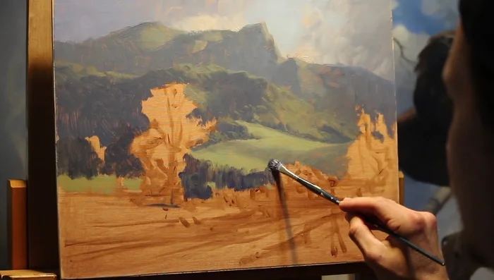 Paint the riverbank, using fragmented brushstrokes to create clumps and tussocks of grass. Suggest water reflections by mirroring colors from above the waterline.