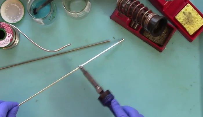 Work the solder up the wire, ensuring even coverage. Remember to keep twisting the wire.