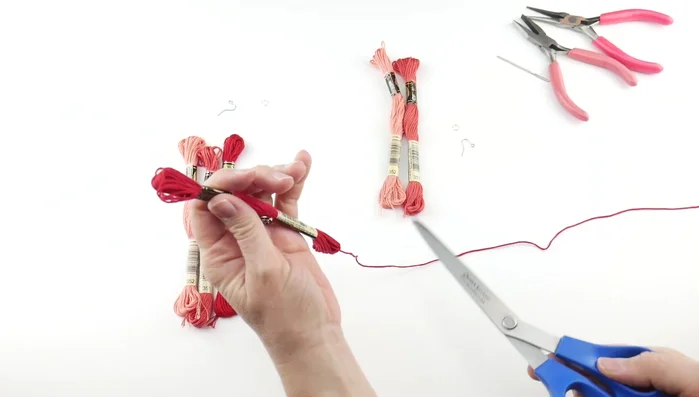 Neaten the tassel: Use a tapestry needle to thread under the top knot to make the tassel less unruly and pointing downwards. Trim any excess loops.