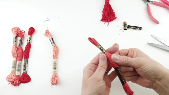 Create multiple tassels: Repeat steps 1-3 for all your embroidery floss in different colors.