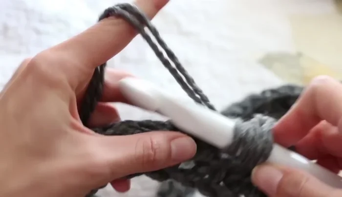 In the second chain from the turning chain, hdc across the row. Repeat step 3 and 4 for each row, changing colors as desired.