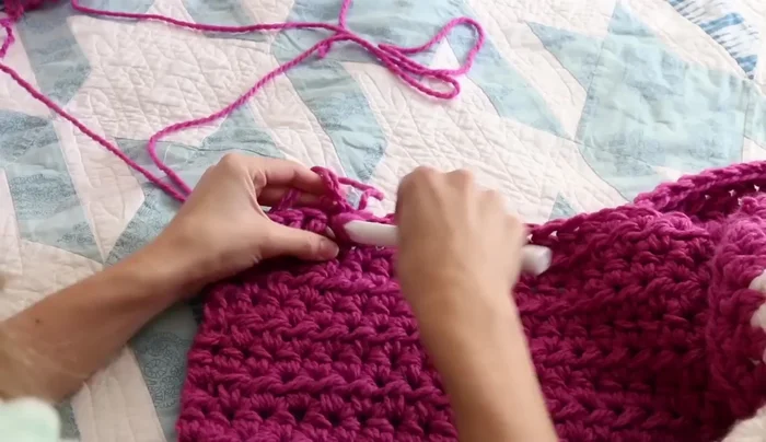 To add a new ball of yarn, tie the end of the old skein to the beginning of the new skein and continue crocheting. Stagger the joins to avoid them ending at the same time.