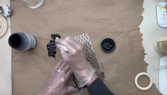 Paint wine bottle netting with black chalk paint, stretching it a few times before and after drying.