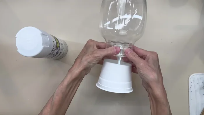 Paint the Dollar Tree vase satin white and the pie plate satin black.