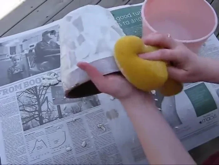 Use a well-rinsed sponge to remove excess grout from the pot, rinsing the sponge frequently.