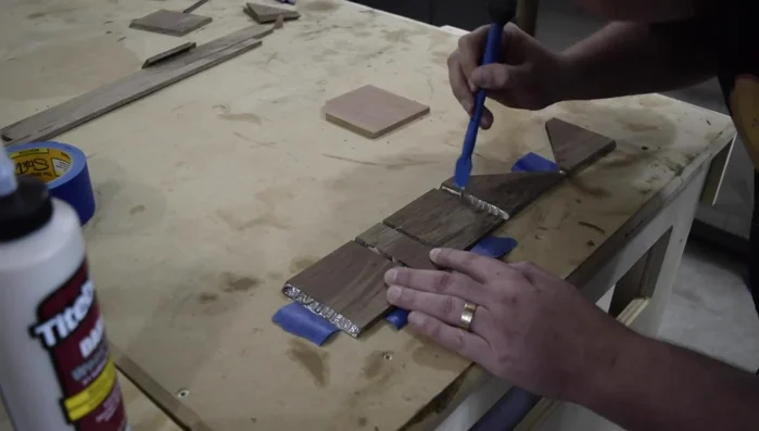 Glue a stop block to the holder.