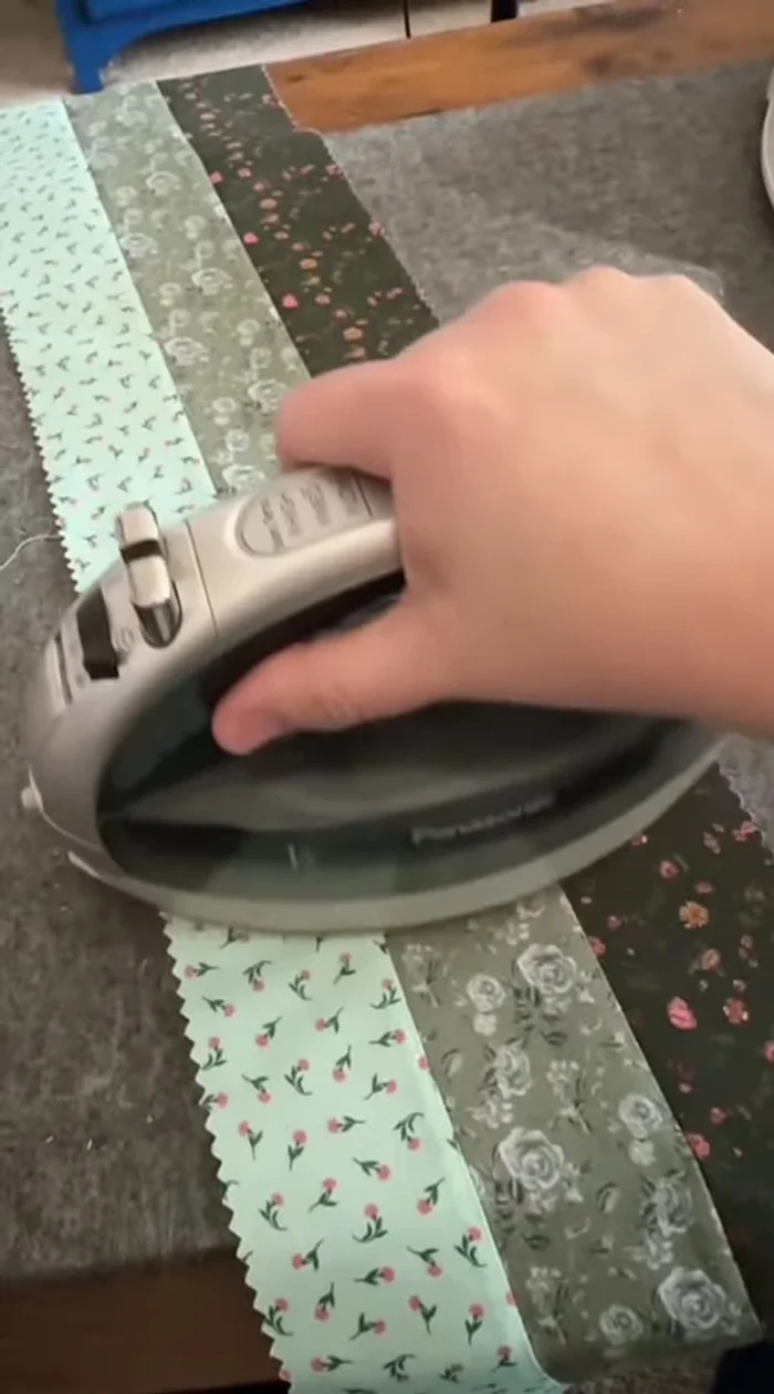 Cut sewn strips into squares (e.g., 6 1/2" x 6 1/2"). Keep leftover fabric for future projects.