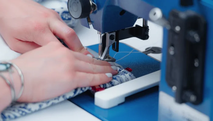 Use a sewing guide with a 3-inch seam allowance for the top pocket. Top stitch 1/4 inch or less from the bottom side of the pocket.