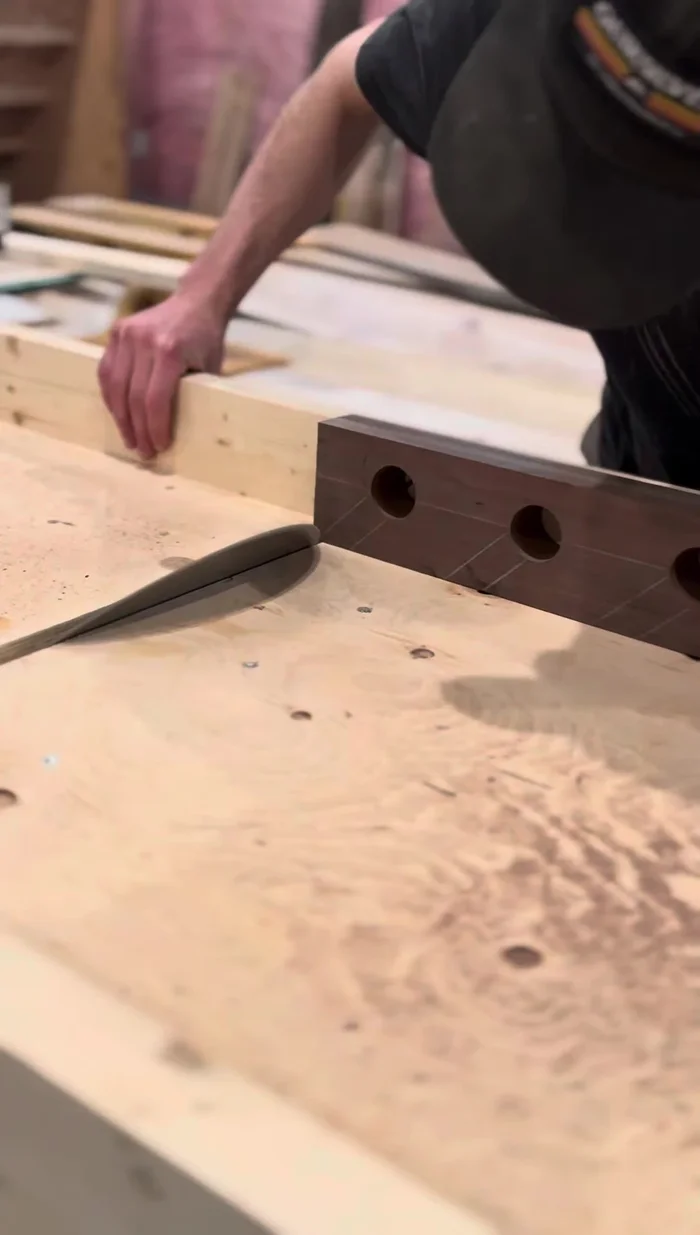 Set the table saw to 45° and use a sled to make the cross cuts.