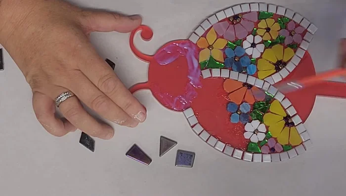 Fill in the ladybug's head with smaller pieces.