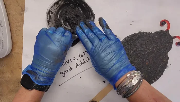 Wipe excess grout with a slightly damp cloth and then buff with a dry cloth.