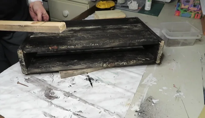 Apply a final coat of stain over the bottom section.