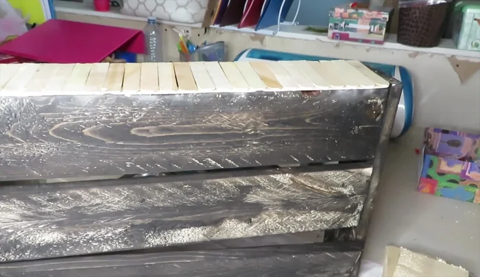 Apply a final coat of stain over the bottom section.