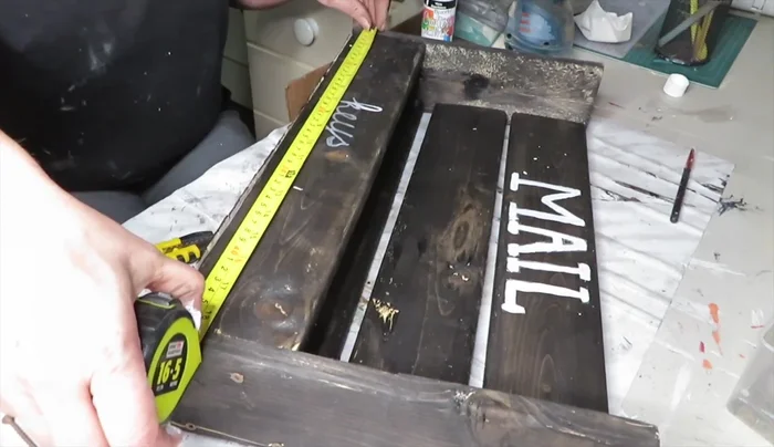 Attach picture frame hangers to the back for hanging.