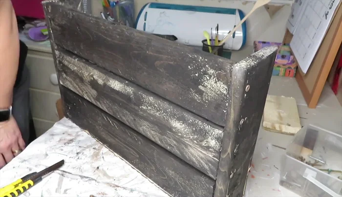 Attach picture frame hangers to the back for hanging.