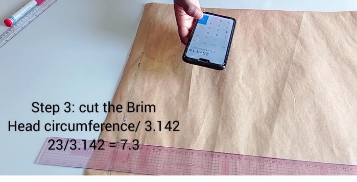 Draft the brim pattern: Divide the head circumference by 3.142. Measure this radius, add a desired height (3 inches used in the tutorial), and add seam allowance (½ inch to the top, full allowance to the bottom). Cut out.