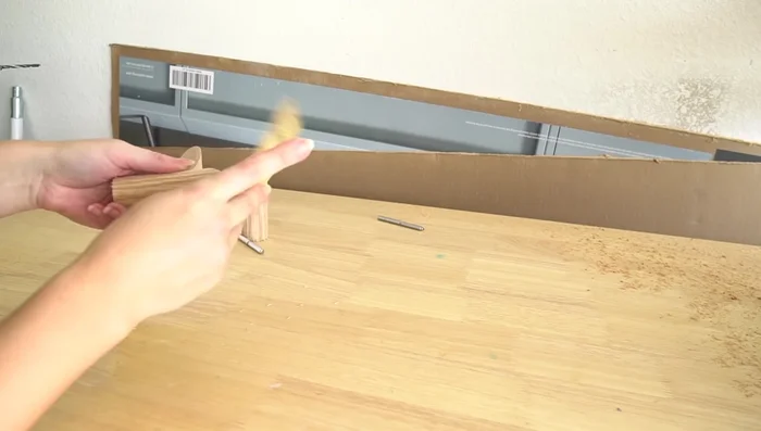 Sand the wood hooks for smoothness.