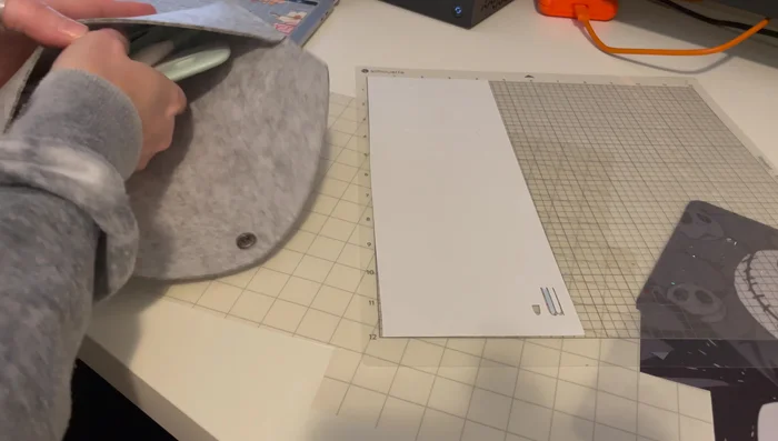 Apply transfer tape to the weeded vinyl, carefully aligning and pressing to adhere.