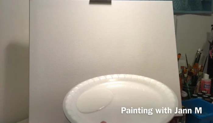 Apply a thick coat of white acrylic paint using a scooping motion. Ensure the paint remains wet.