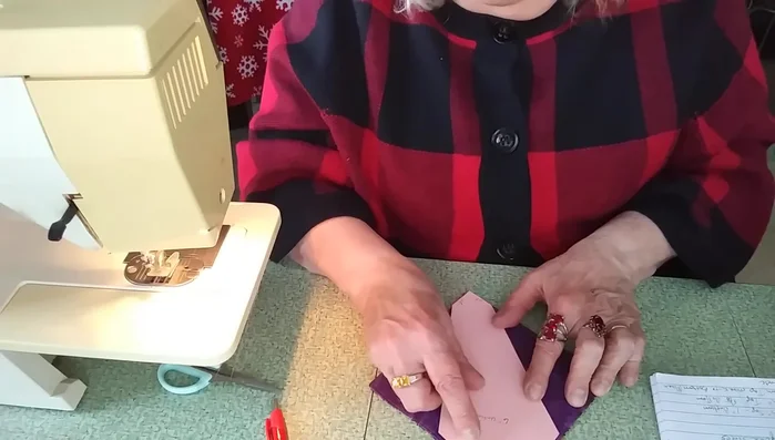 Mark and cut: Place the template onto your sewn square and mark the template lines onto the fabric. Cut along the marked lines to create the petal-like shapes.