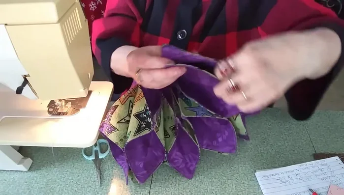 Join the circle: Attach remaining fabric squares in a similar manner, creating a circular shape. Sew the final seam to close the circle.