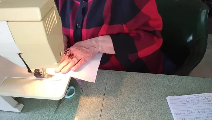 Turn and press: Turn the sewn piece right-side out through the opening. Use a bodkin or a blunt pen to push out the corners neatly. Press the seams flat.