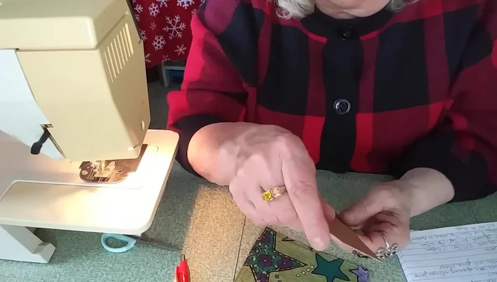 Create the template: Create a template from a 6-inch square of cardboard or cardstock. Make marks at 2.5 inches from one corner and 1 inch from the adjacent corner on each side of the square. Connect these points to create the template shape.