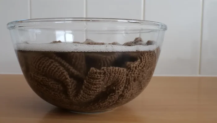 Sew on buttons using sewing thread.