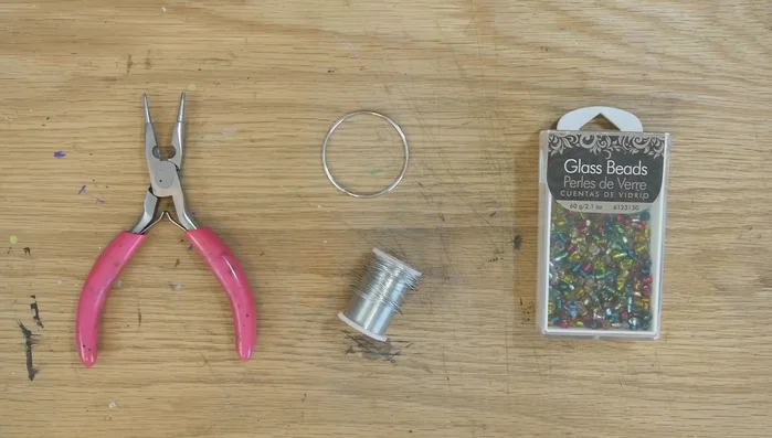 Cut 12 pieces of wire (approx. 12 inches each) and fold them in half.