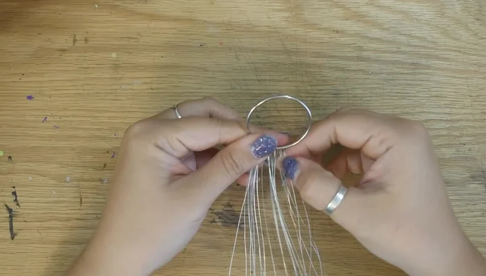 Flip the wires up, inside the ring, and twist them together to form the trunk. You can bend the trunk for a more interesting look.