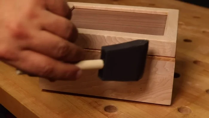 Apply shellac finish.