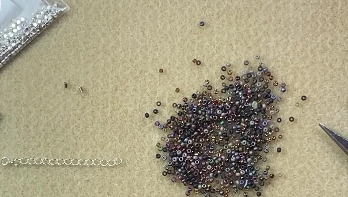 Prepare the beading wire: Cut approximately 18 inches of beading wire. Attach a crimp bead to one end, leaving a small tail.